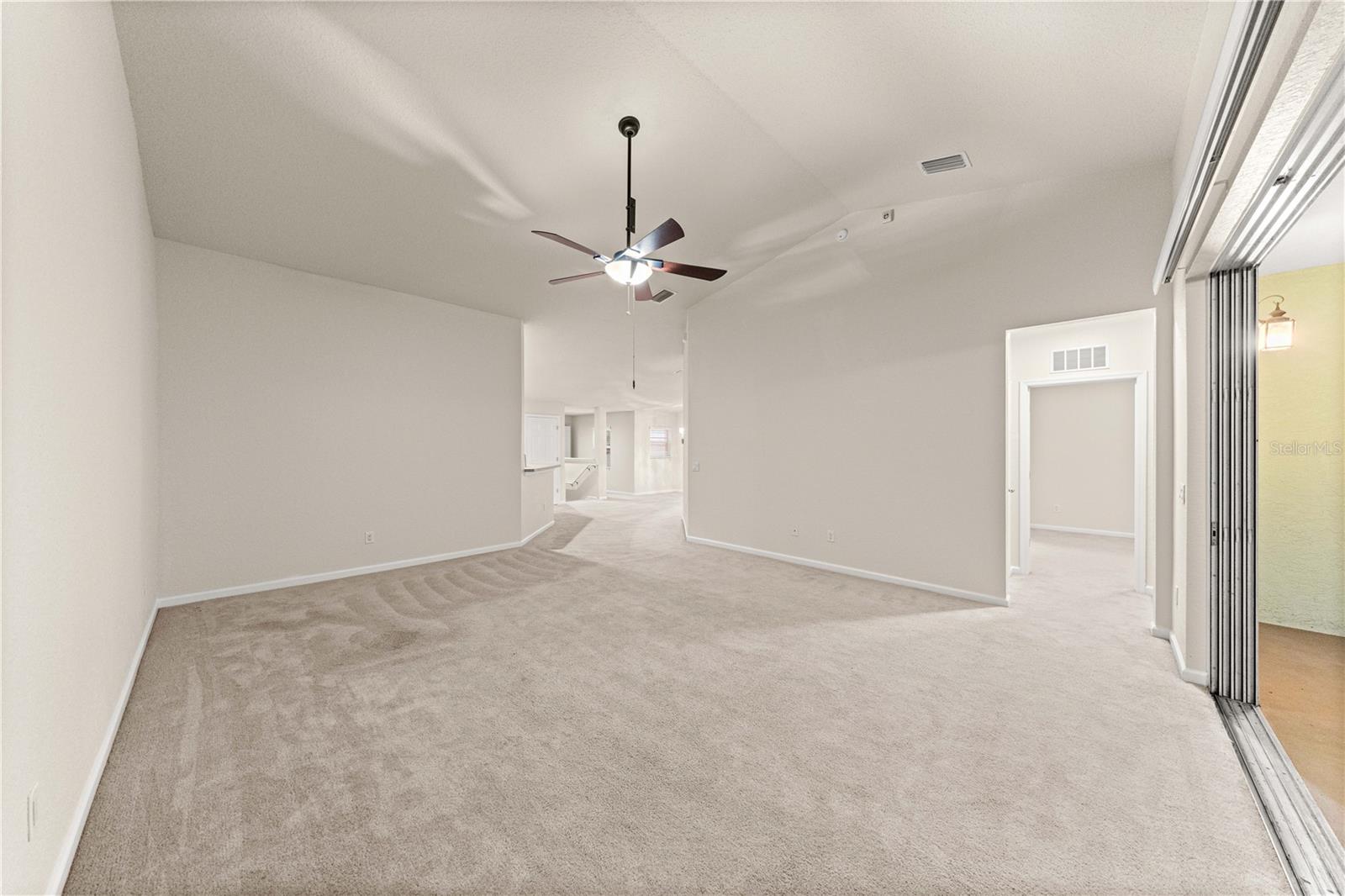 Living Room with telescoping sliding doors to screened in back patio