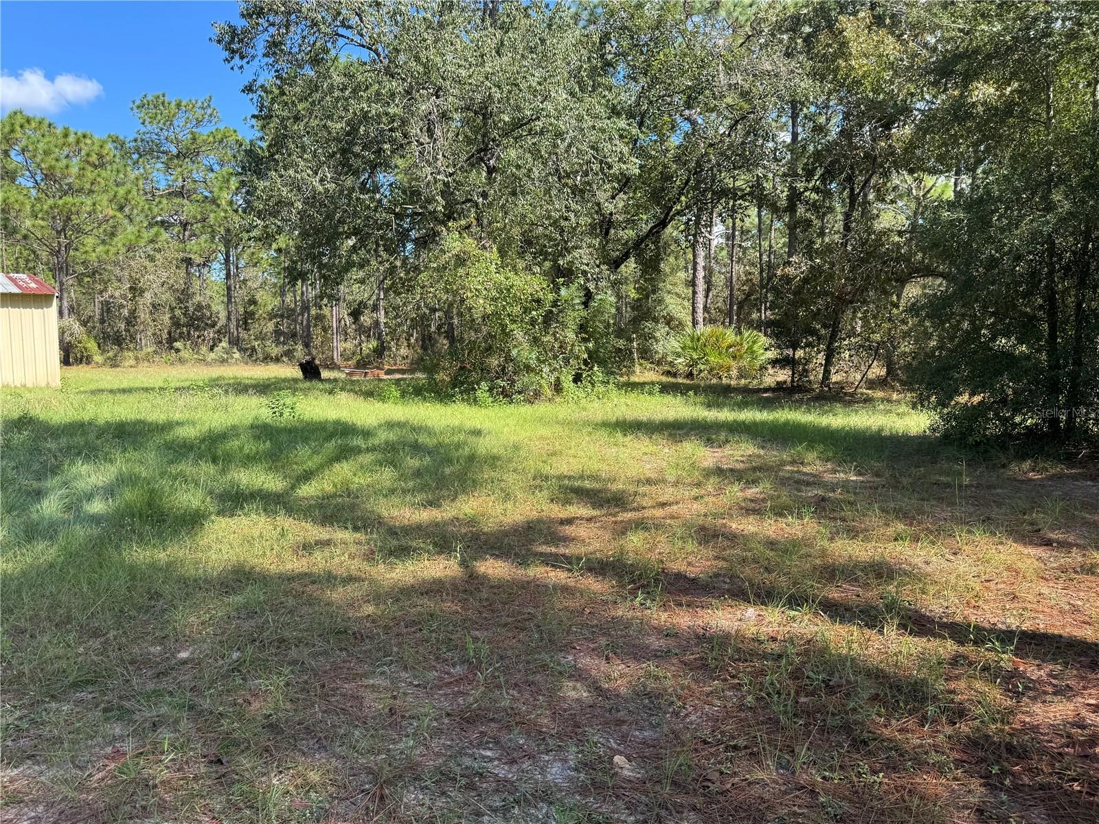 LOT 21 LOOKING FROM FRONT ALONG ROAD OF .24 ACRE LOT 21 (WESTSIDE) TO CENTER AND BACK, (EASTSIDE) OF LOT. TO THE LEFT (NORTHSIDE OF LOT),  IS 2615 SW 15TH CT HOME FOR SALE ALSO. BOTH PROPERTIES CAN BE SOLD TOGETHER OR SEPARATE
