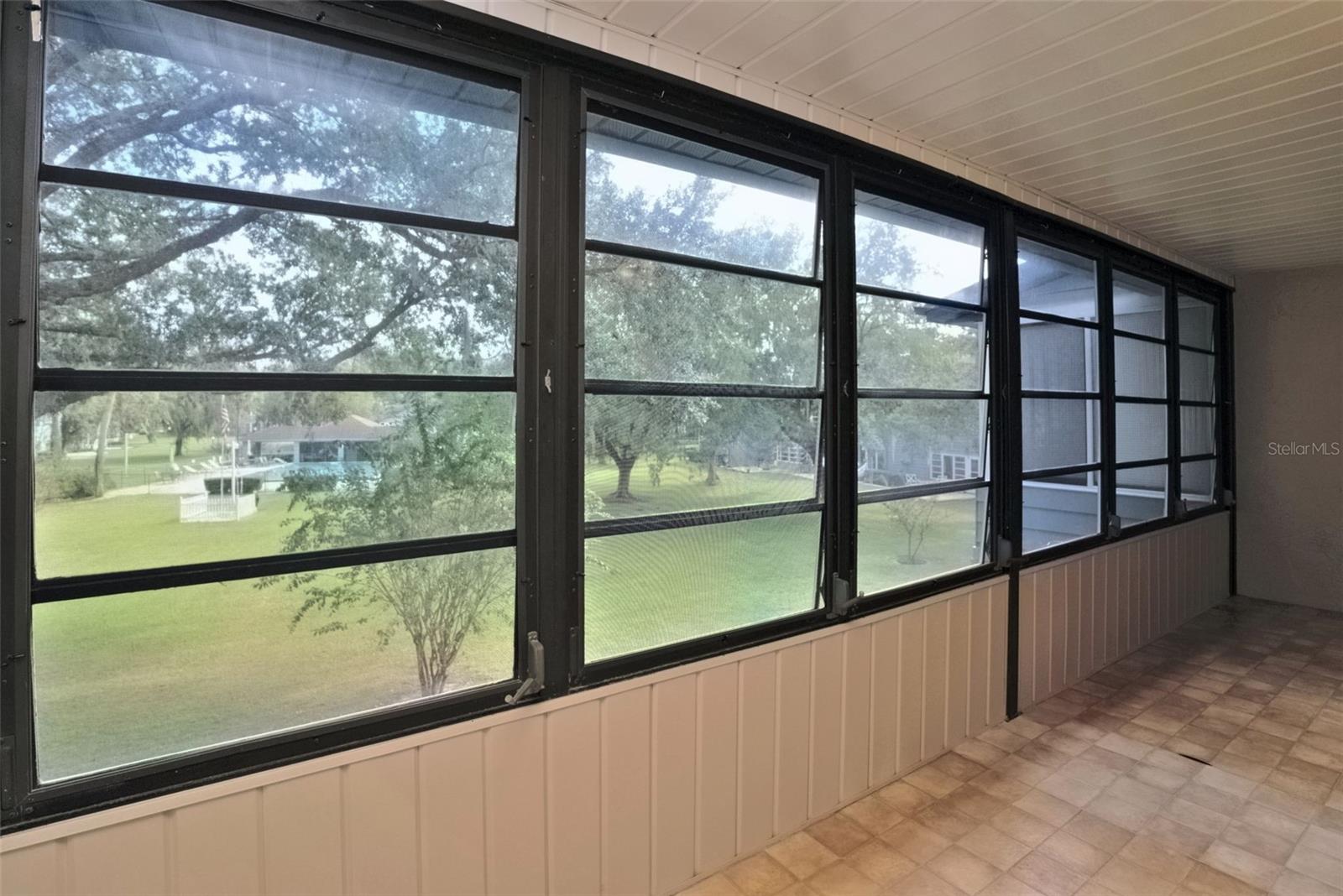 Lanai is screened in with roll open or closed windows