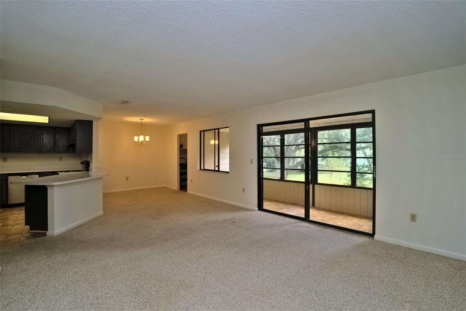 Family Room, Looking at Dining Room, Sliding Glass Doors Lead to Lanai on the right