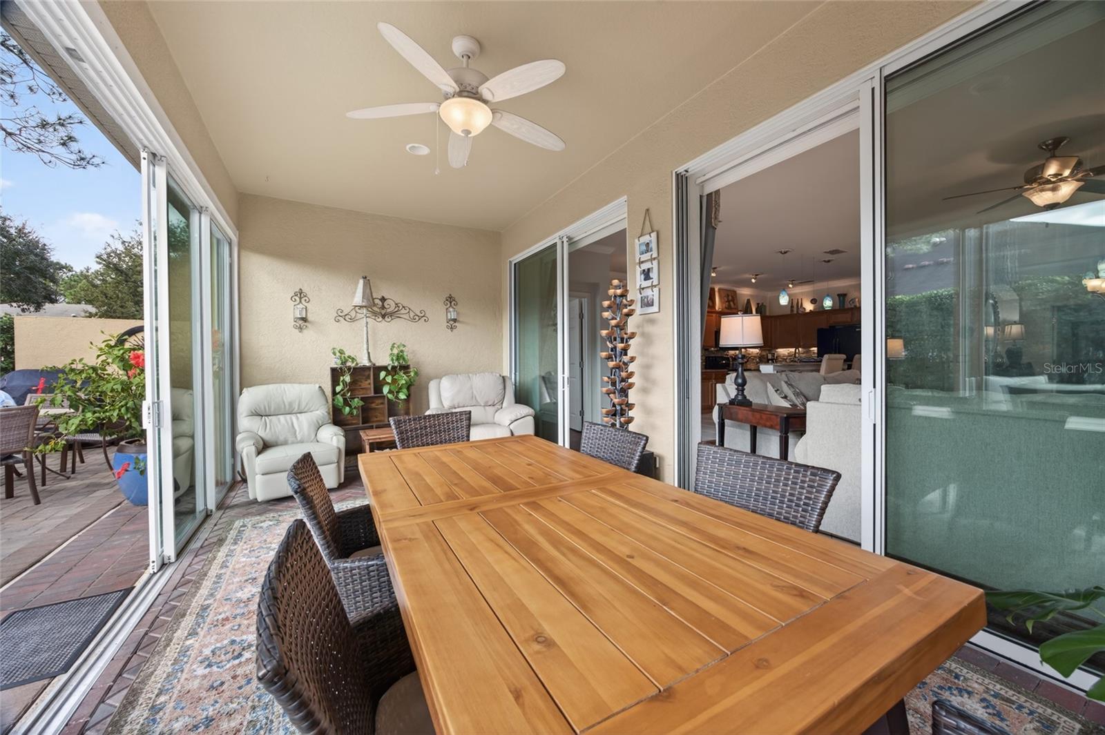 View of sunroom and private back patio.