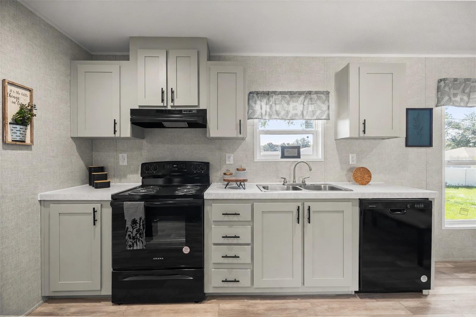 Kitchen with Shaker cabinets and double sink