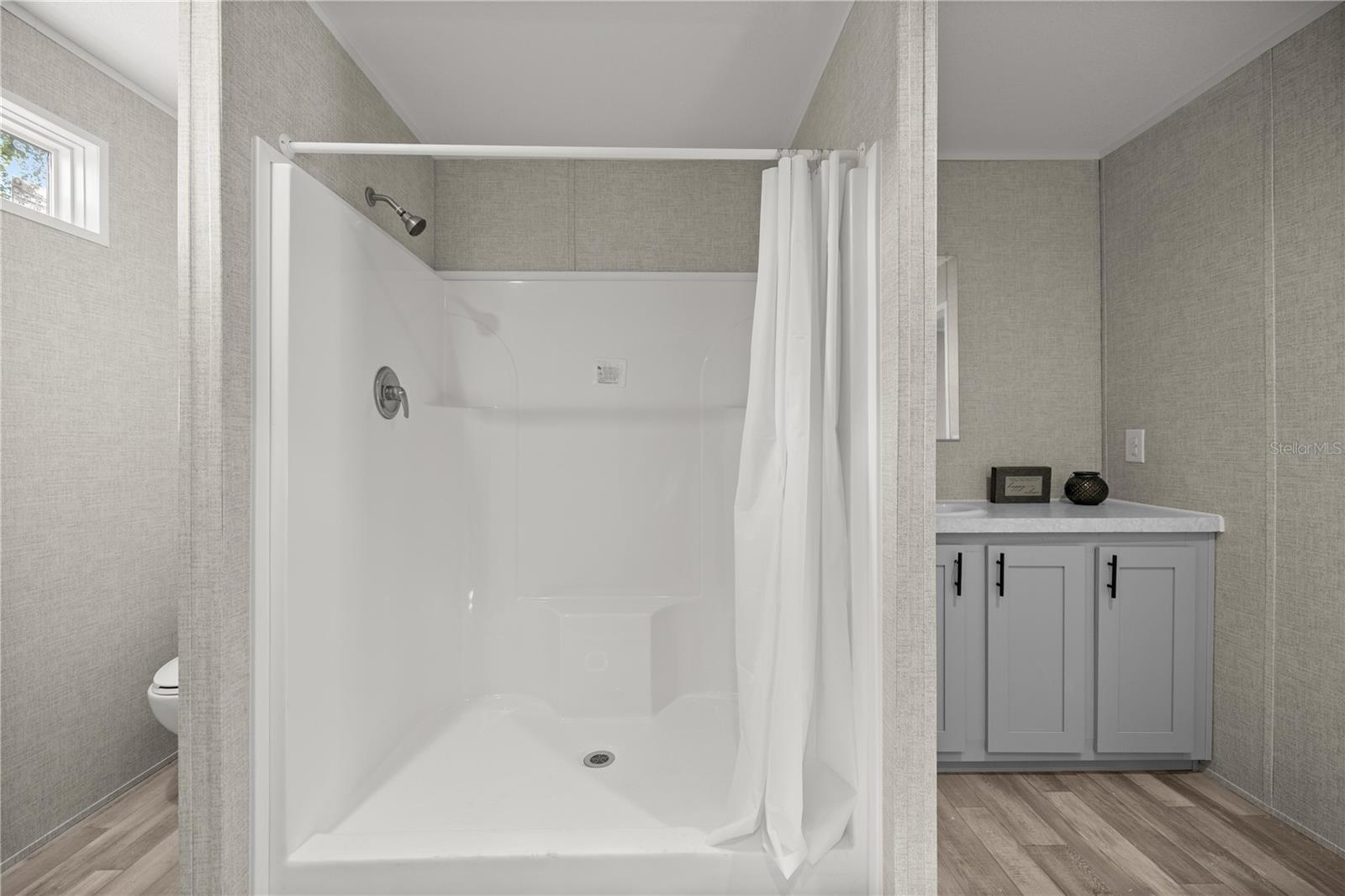 Primary Walk in Shower and private toilet