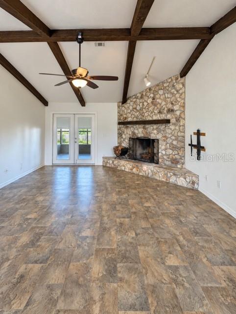 Spacious family room with fireplace and french doors