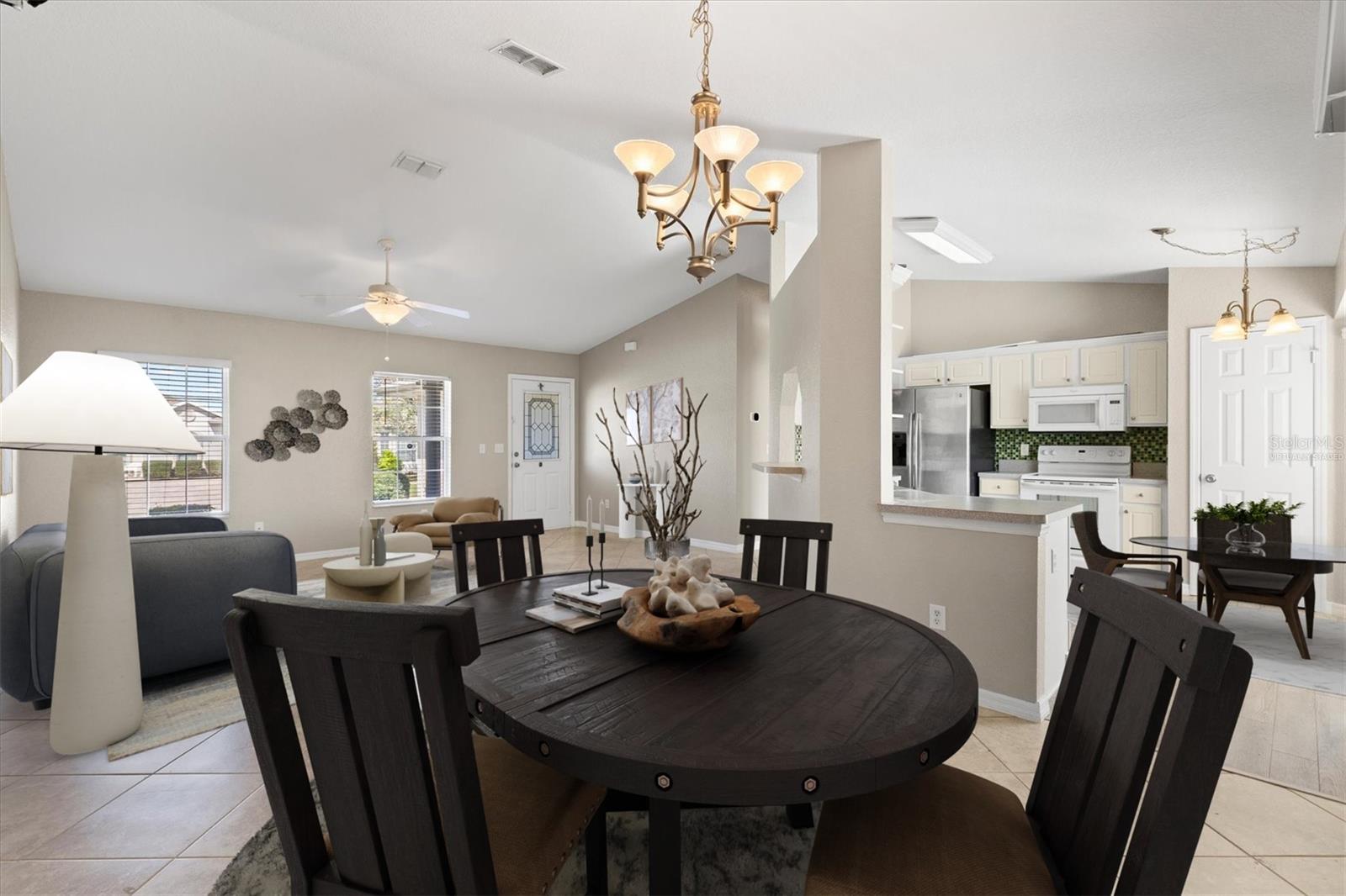 Virtually staged dining room and living room.