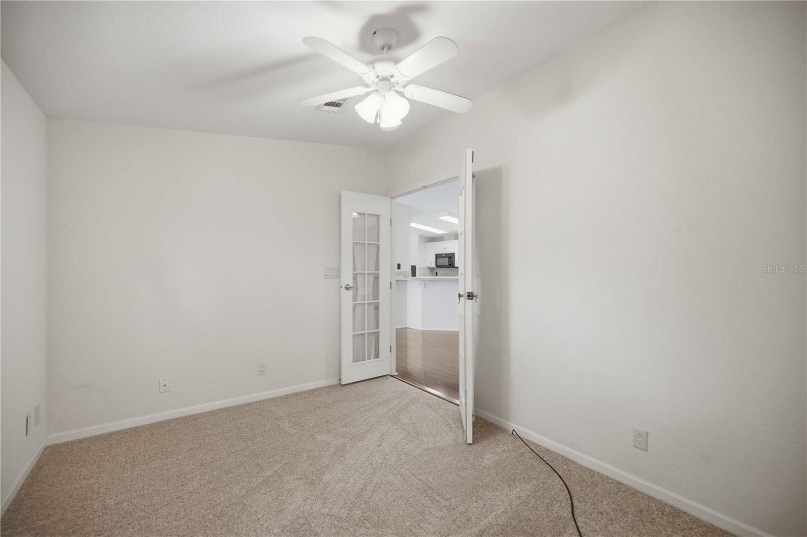Second bedroom w/ French doord