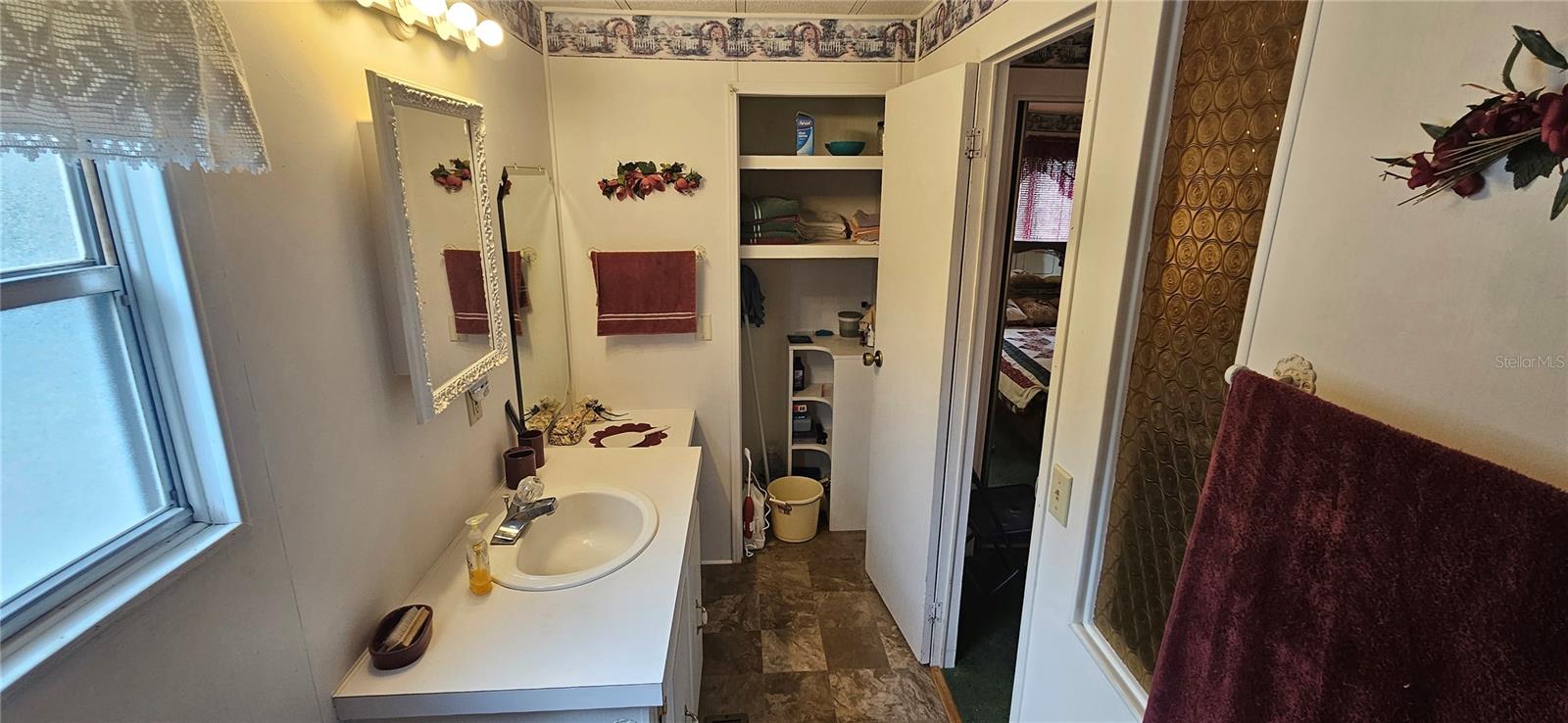 Primary Sink and Linen closet side