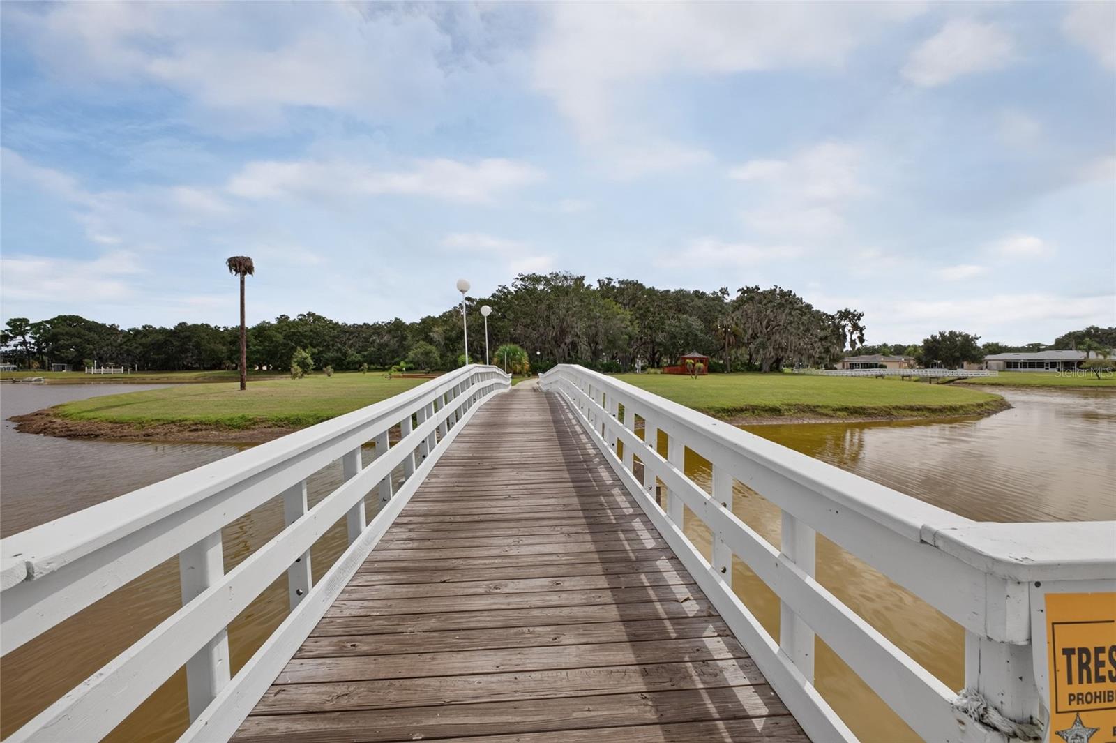 Heading over the bridge to the "Island".  Outdoor amenities are located on the Island and easily accessible from all homes.