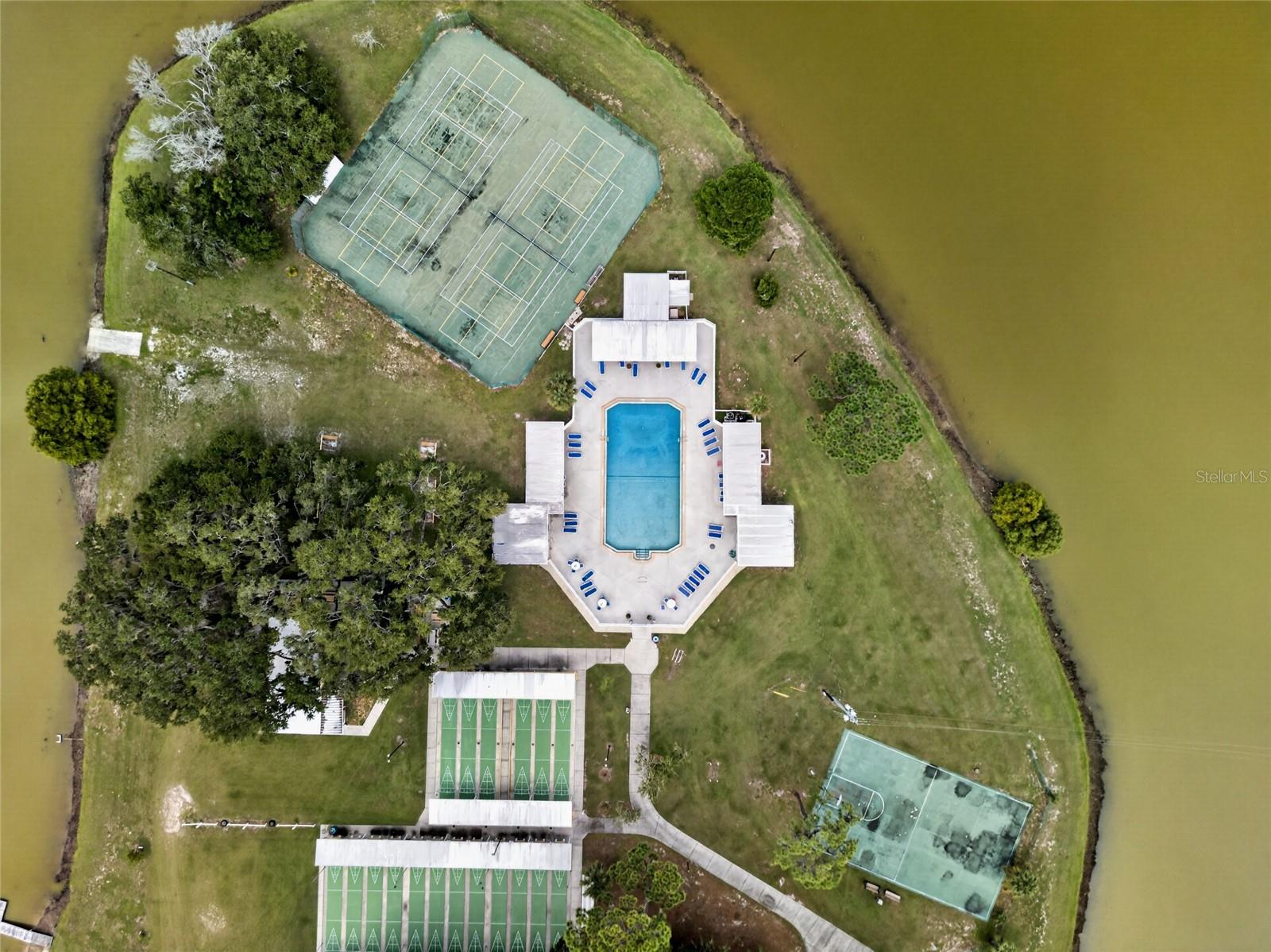 The Island houses the community pool, shuffle board courts, tennis/pickle ball courts, basketball, horseshoe pits, and occasional cookouts.