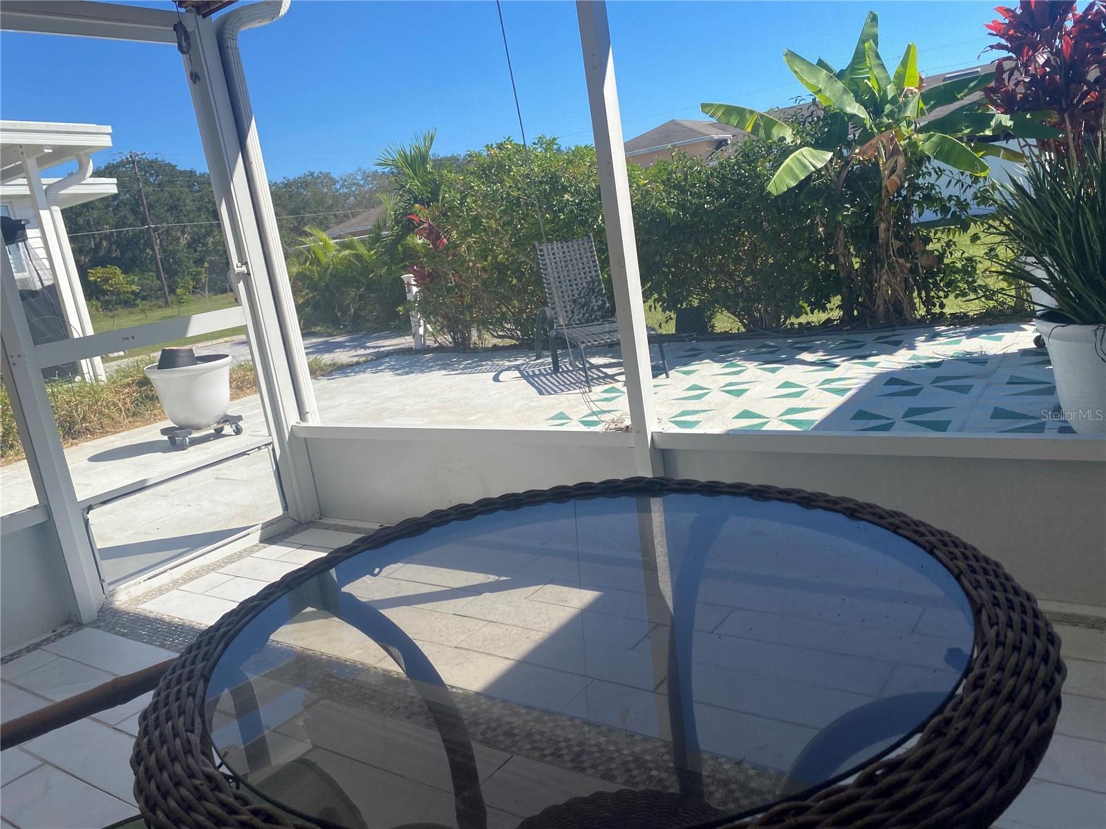 Back screened porch opens to your courtyard.
