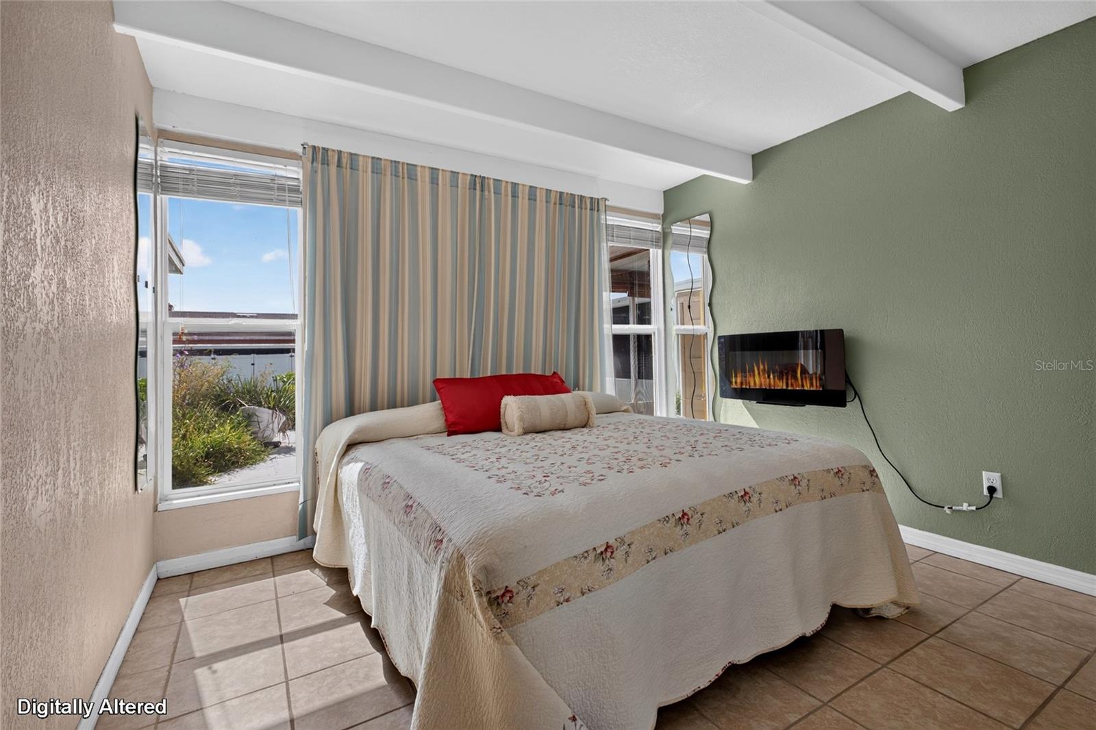 Master bedroom has 2 sidelights on either side of the bed which provides natural light into the home.