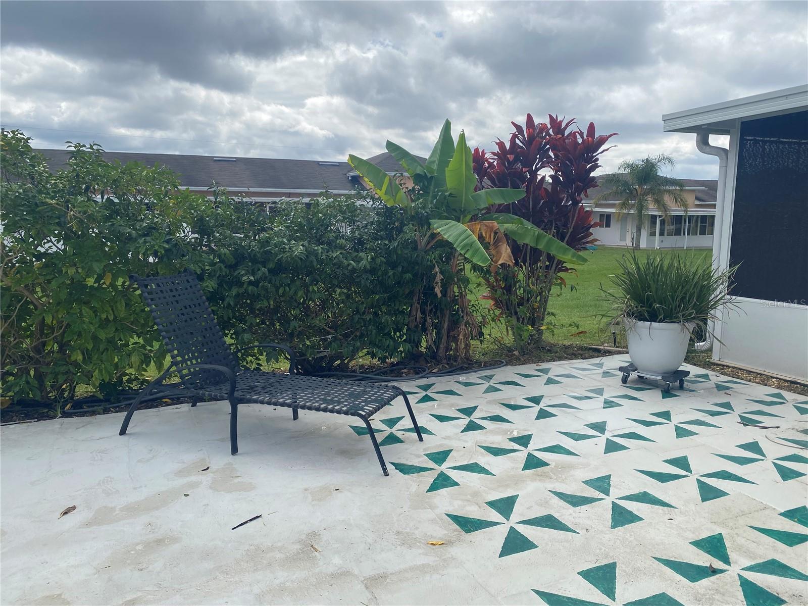 Beautiful landscaping provides privacy to the back courtyard area.