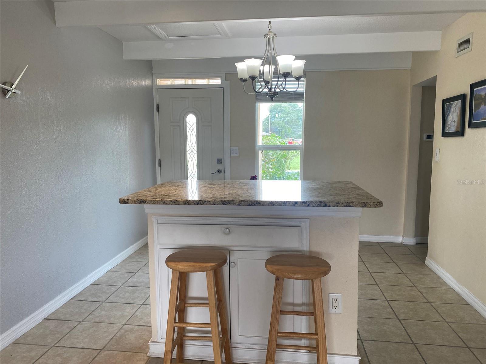 Breakfast bar looking to the front door.