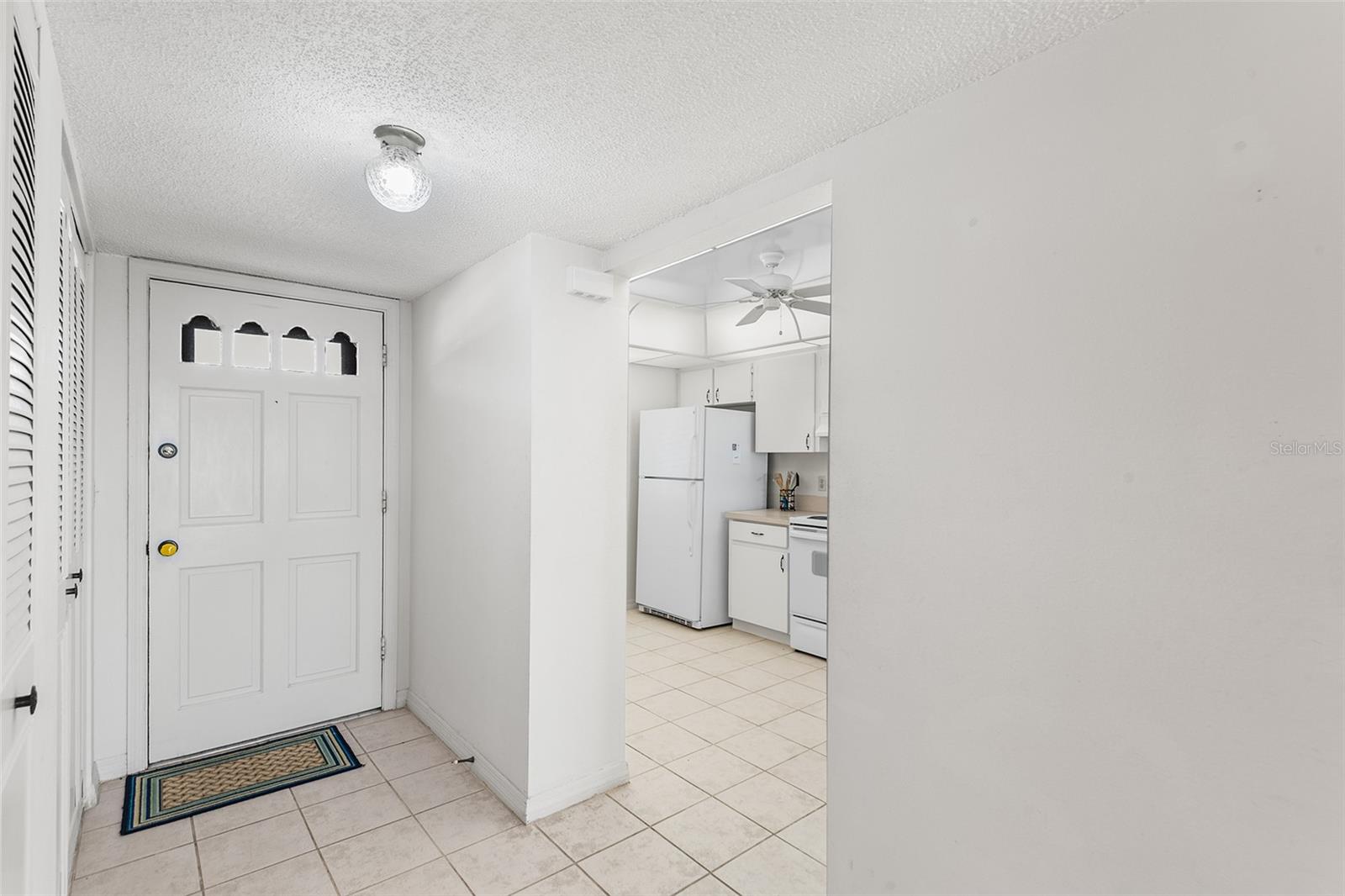 VIEW TOWARDS FOYER AND KITCHEN