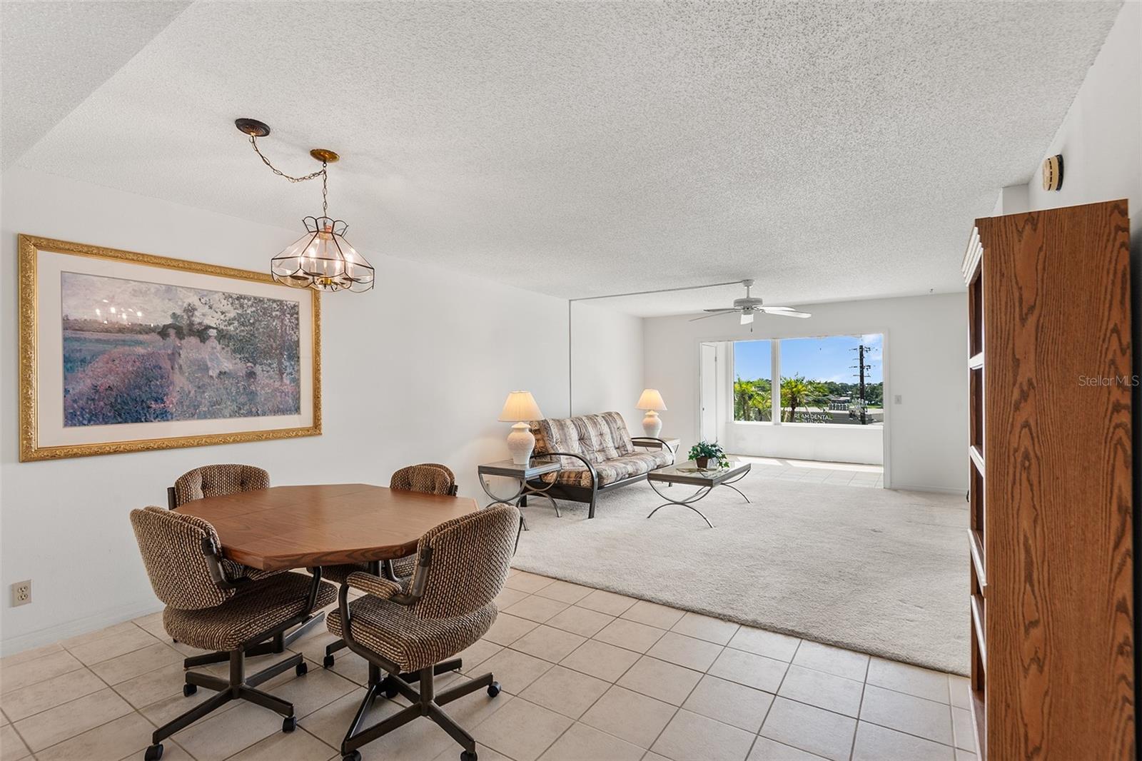 DINING AREA . VIEW TOWARDS LIVING ROOM AND BONUS ROOM