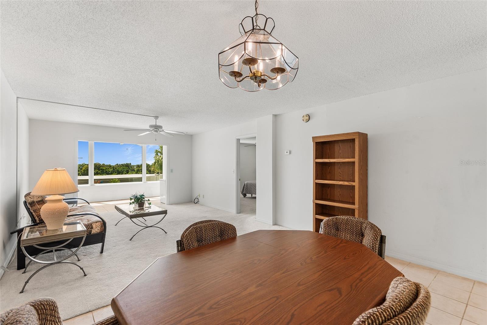 DINING AND LIVING ROOM AREA. BONUS ROOM BEYOND