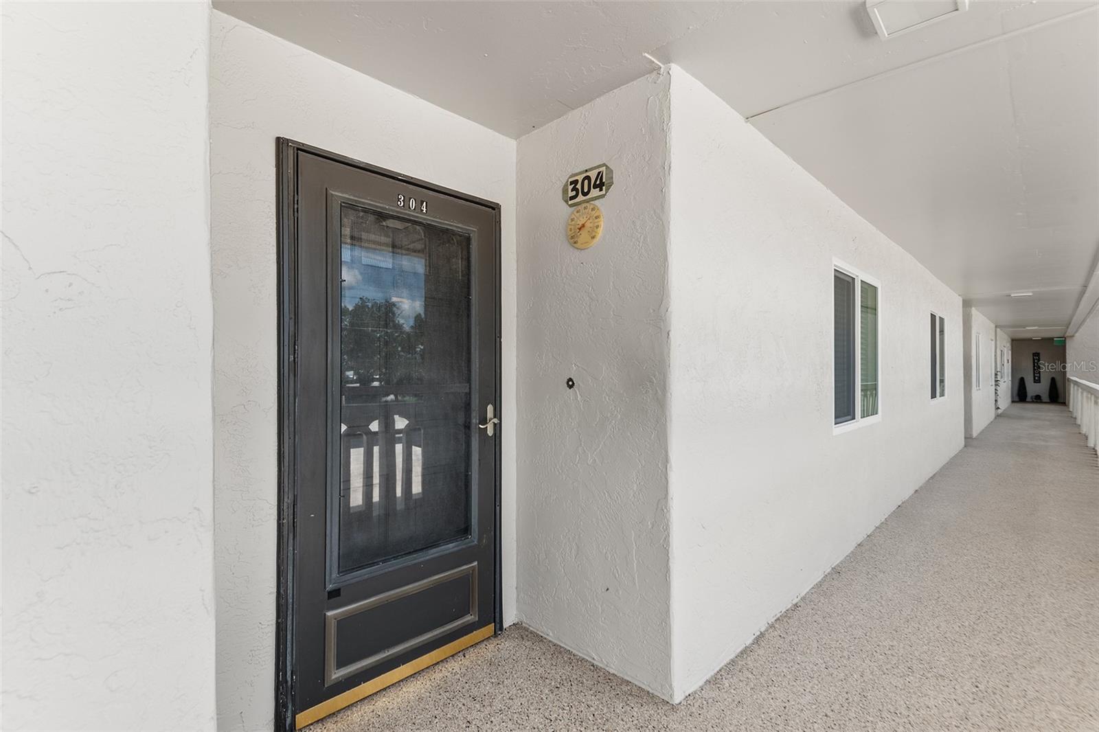 FRONT ENTRY OF UNIT. NOTE STORM DOOR.