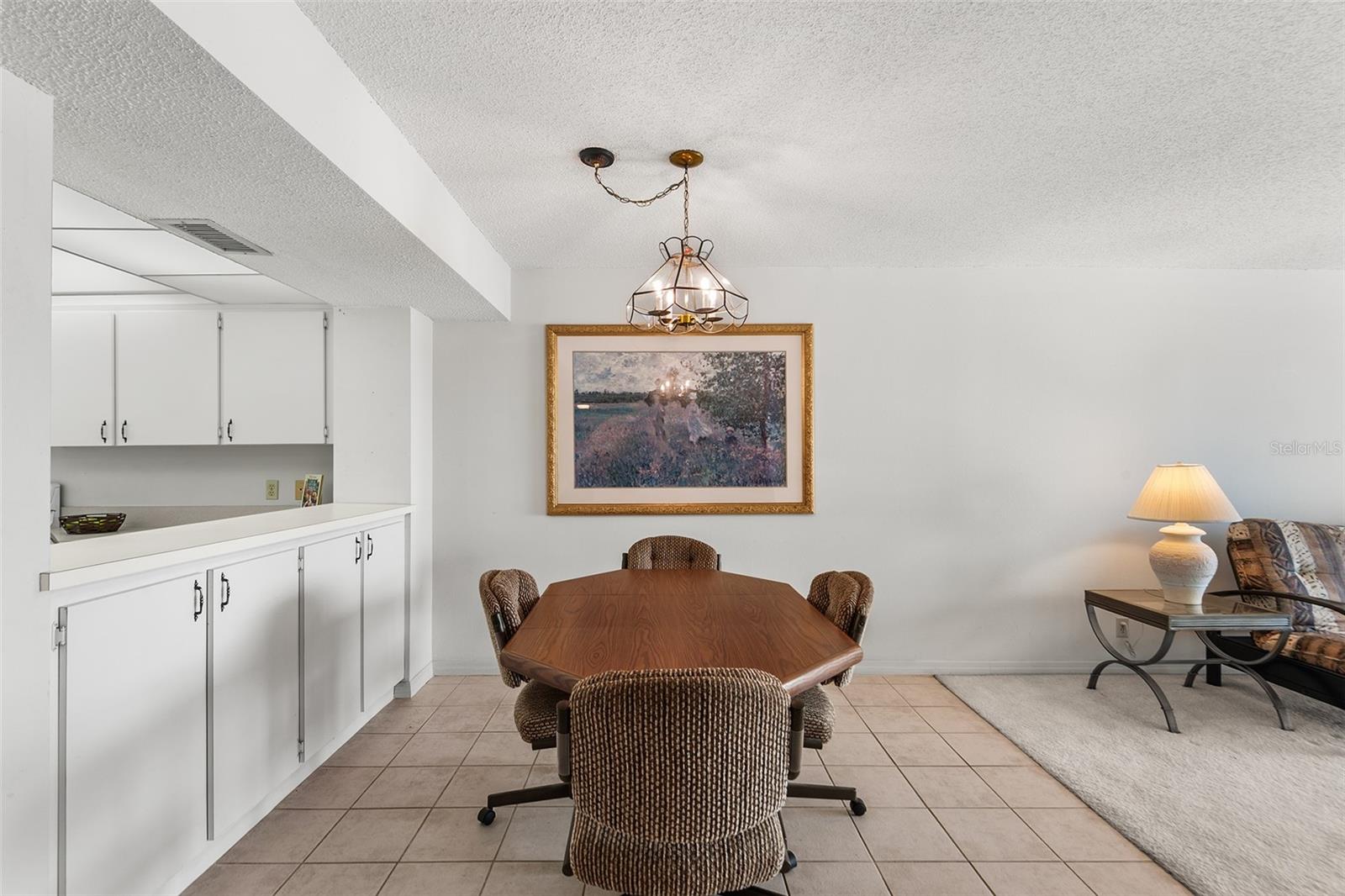 DINING AREA. PASS TRU FROM KITCHEN TO LEFT.