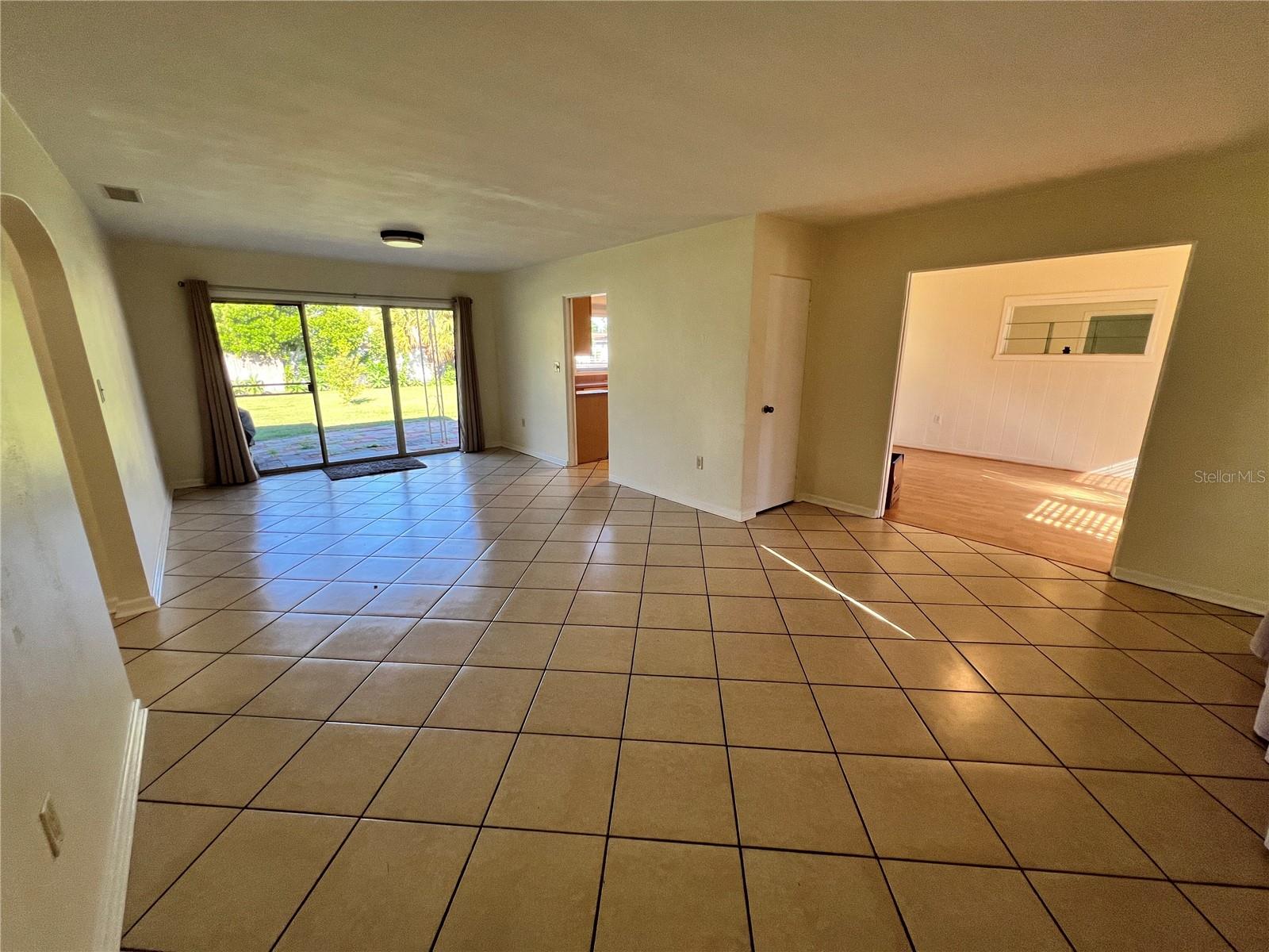 Dining/Living room combo with sliding glass door to back yard
