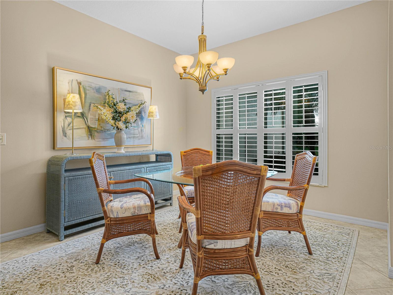 Formal Dining Area with Plantation Shutters and Upgraded Lighting Fixtures Formal Dining Area with Plantation Shutters and Upgraded Lighting Fixtures