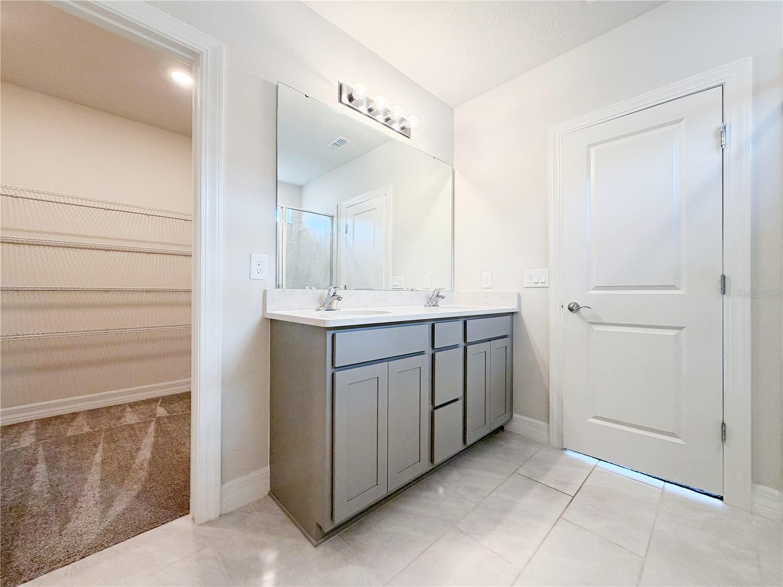 Dual sinks and a large walk in closet