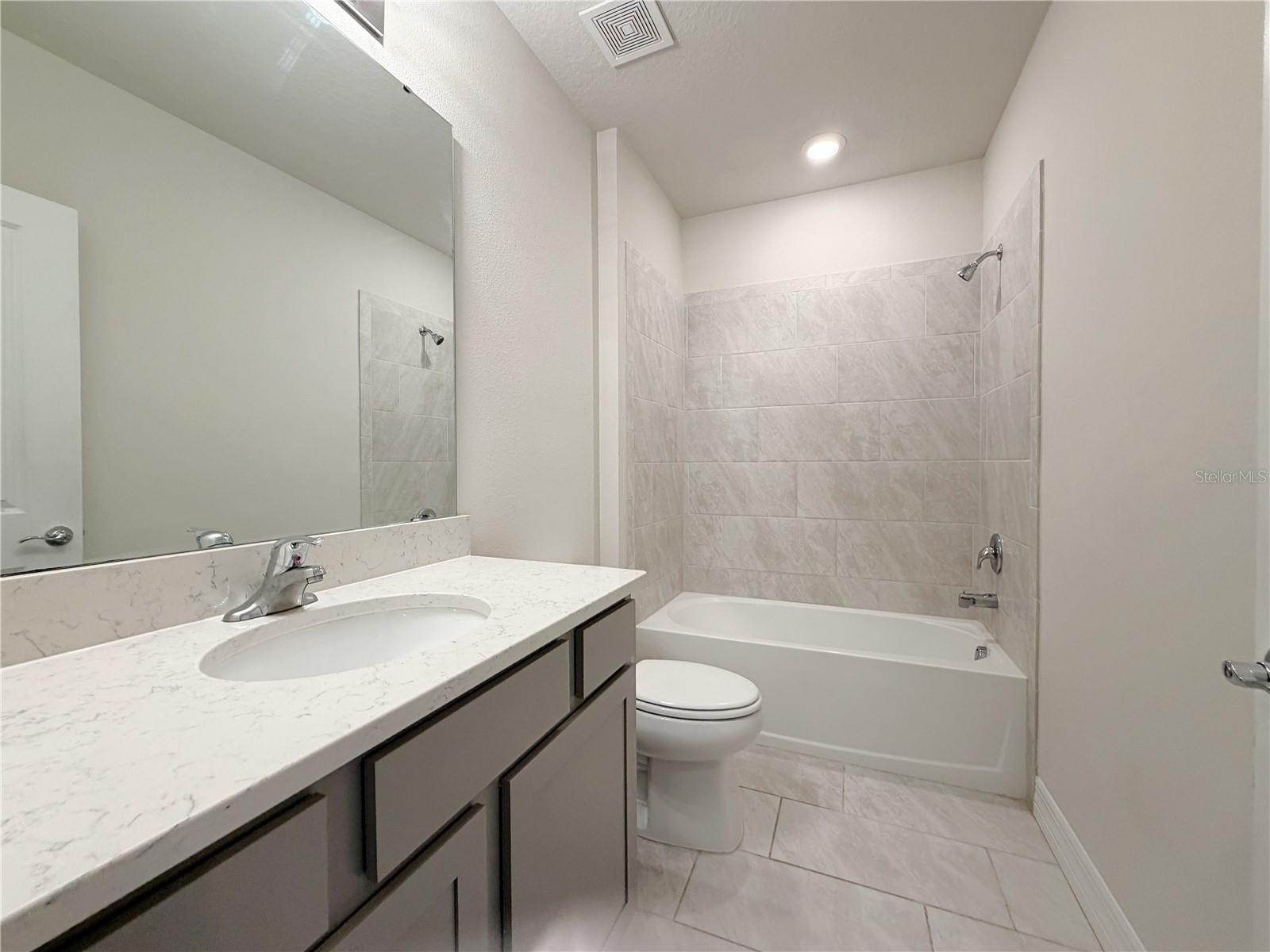 Guest bath is located in the hall between the 3rd and 4th bedrooms