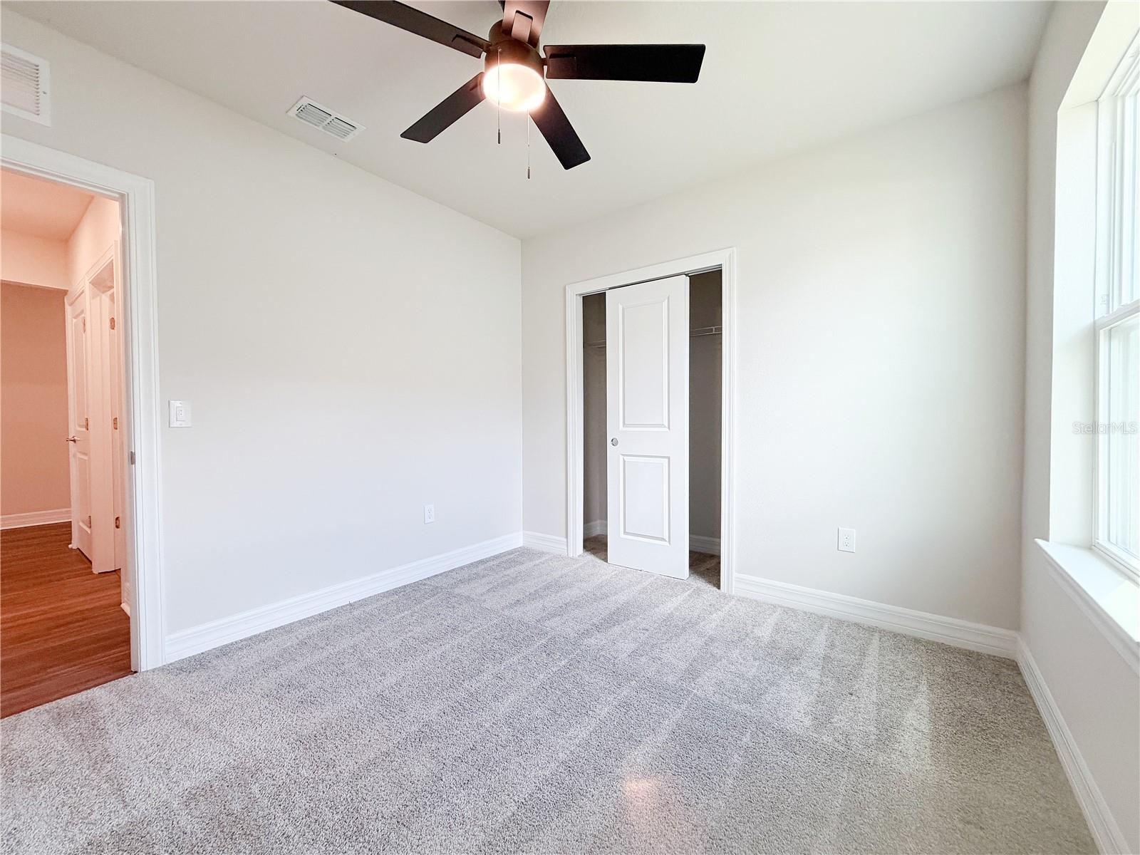 Second bedroom is situated away from the other bedrooms, offering privacy