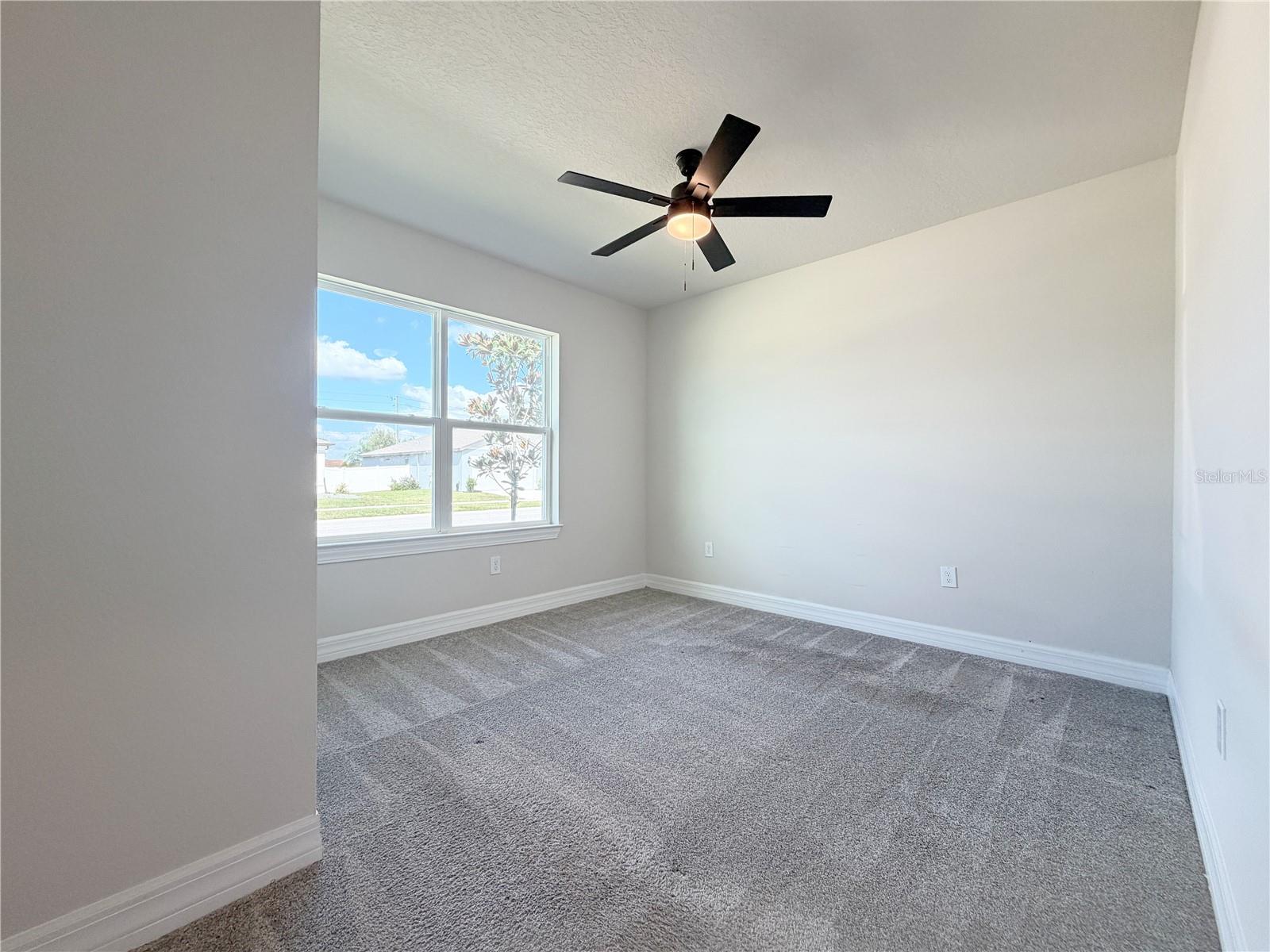 Fourth bedroom at the front of the home offers wonderful natural light