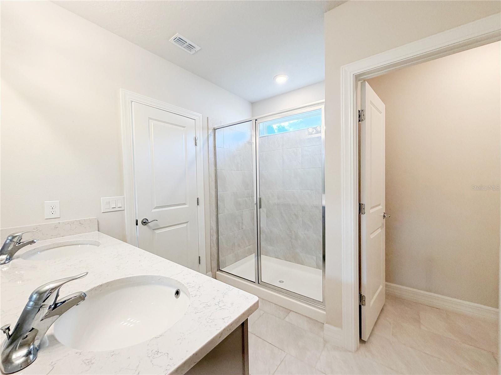 Master bathroom offers a water closet and walk in shower