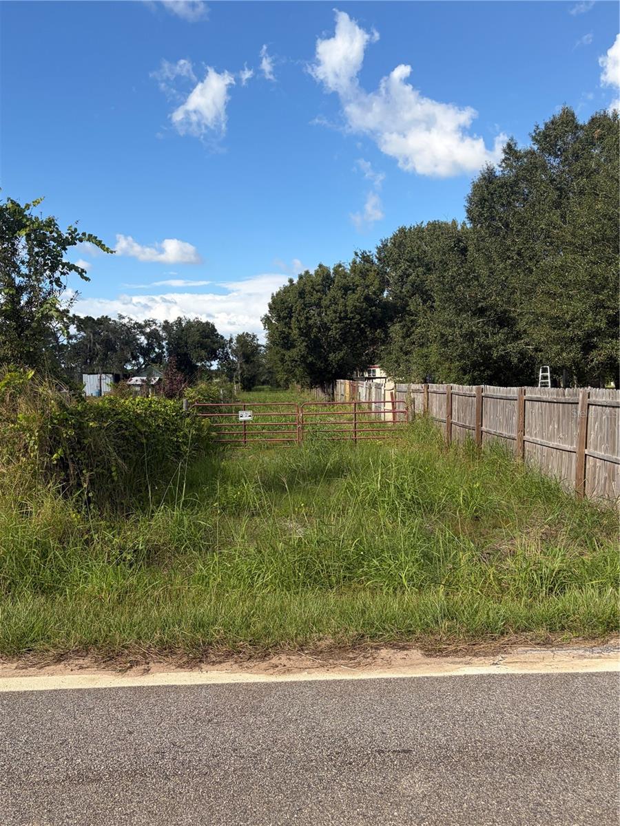 Gate Entry to 400 foot driveway leading to property. Gate Entry to 400 foot driveway leading to property.