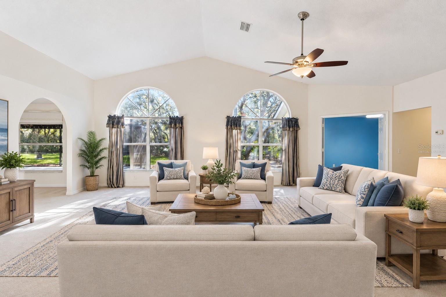 Virtually Staged Living Room with Large Arched Windows