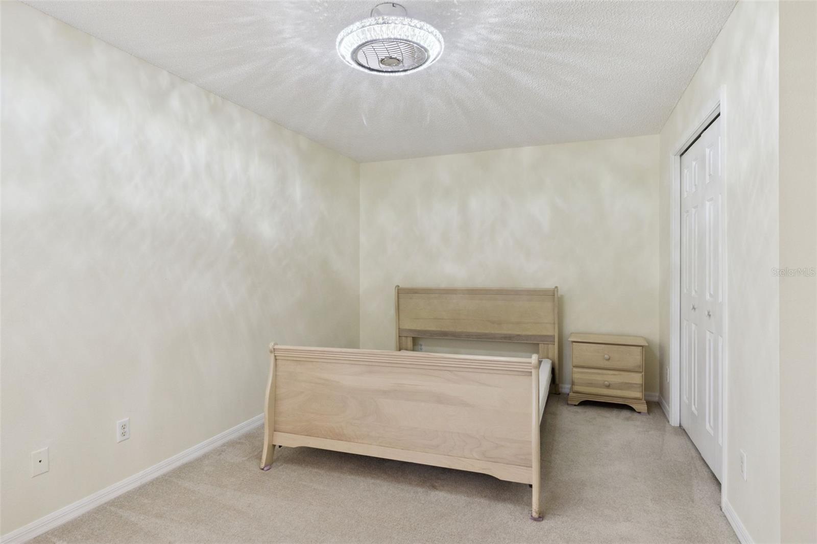 Bedroom #2 features a Fandelier Ceiling Fan