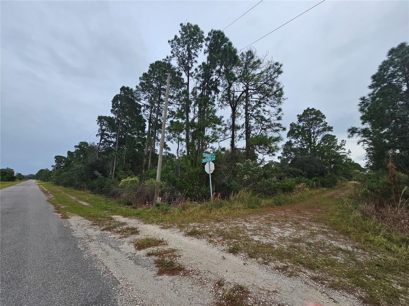 Paved road on 1 side, dirt road on the front side.