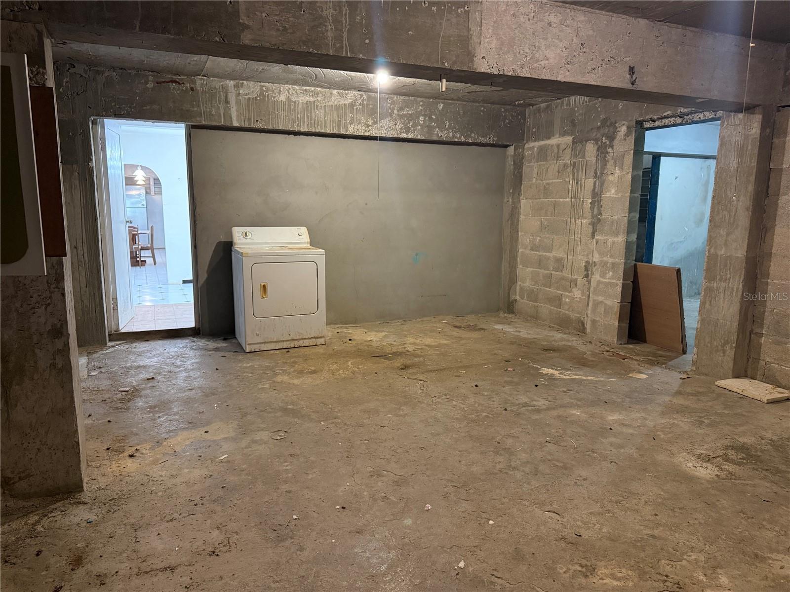 Dry storage - full of potential to be the kitchen and living room of a new unit.