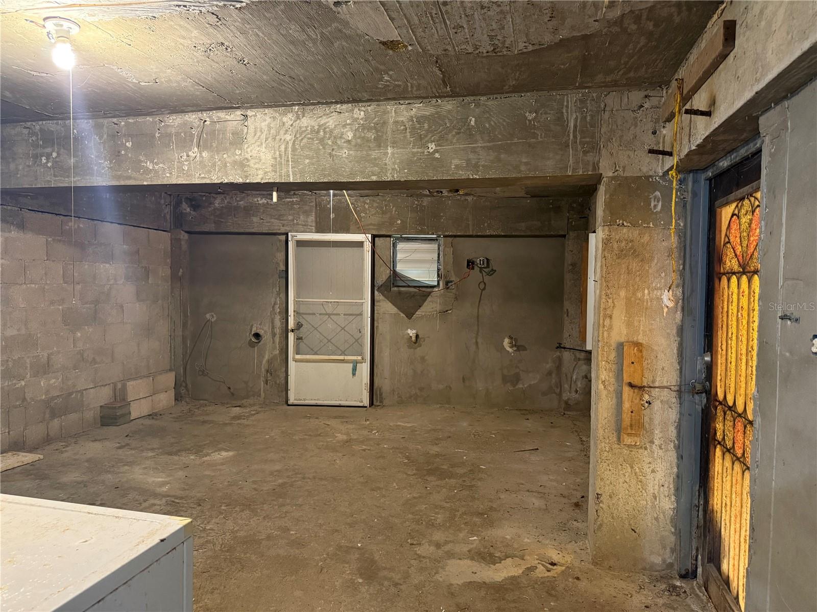 Dry storage full of potential to be the kitchen and living room of a new unit.