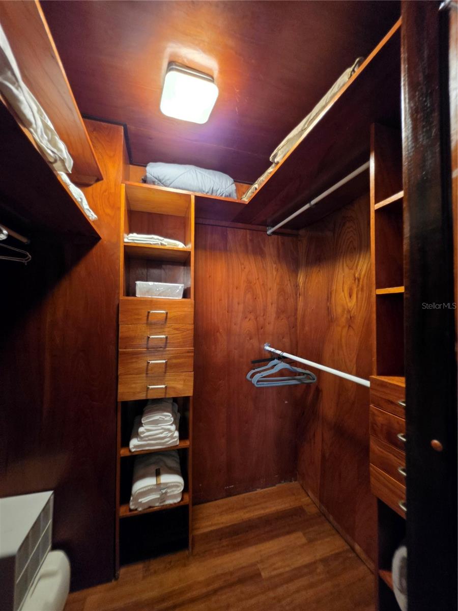 Primary bedroom walk-in closet