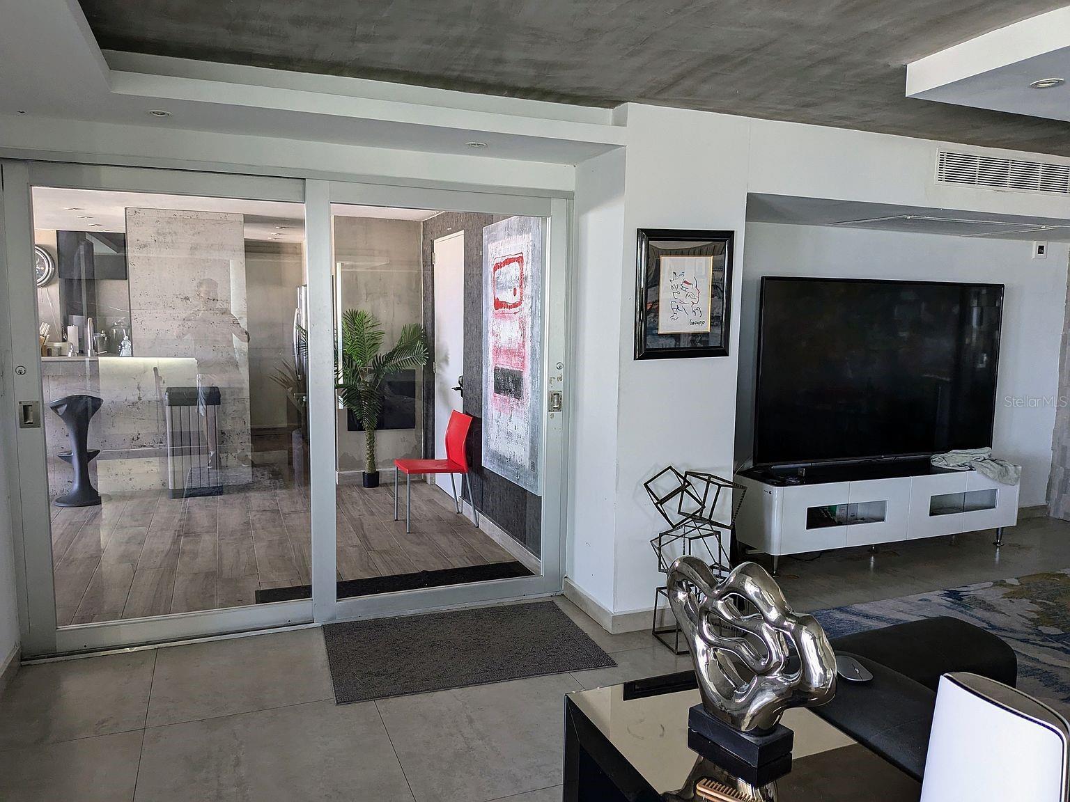 Living area  glass sliders to covered terrace