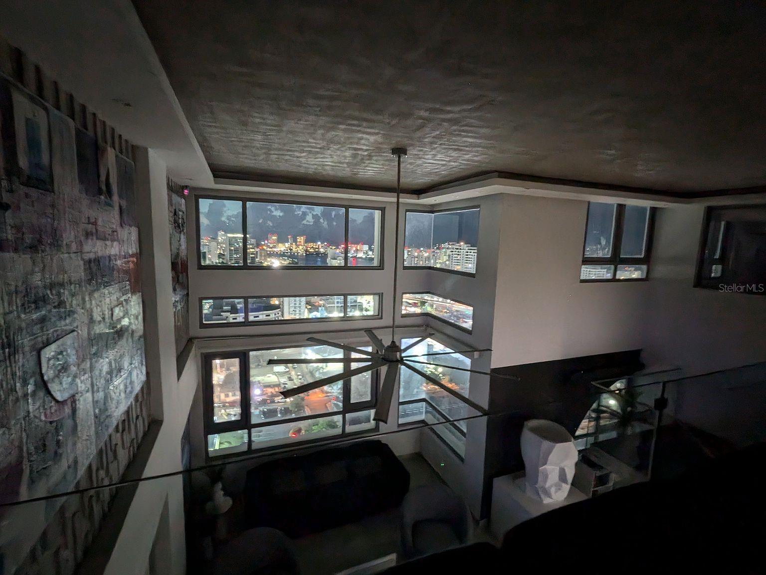 Living room  night city views from loft