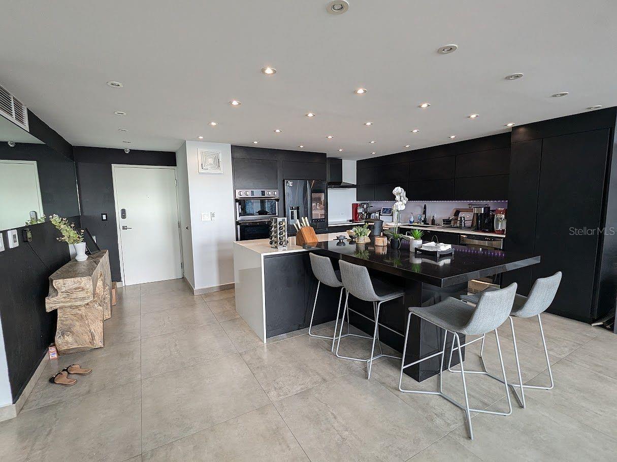 Kitchen  black cabinetry and large island