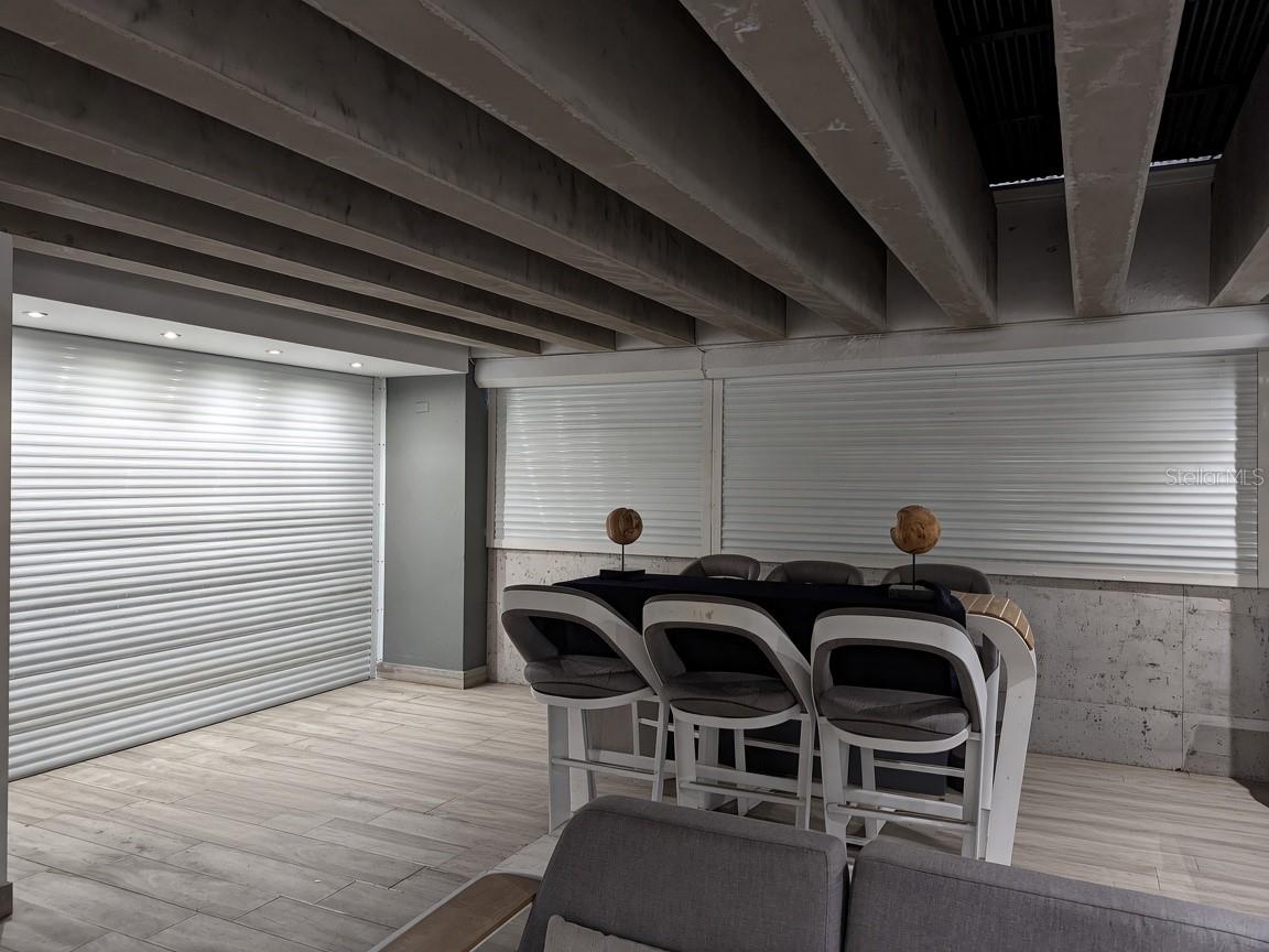 Covered terrace  full storm shutters enclose the terrace