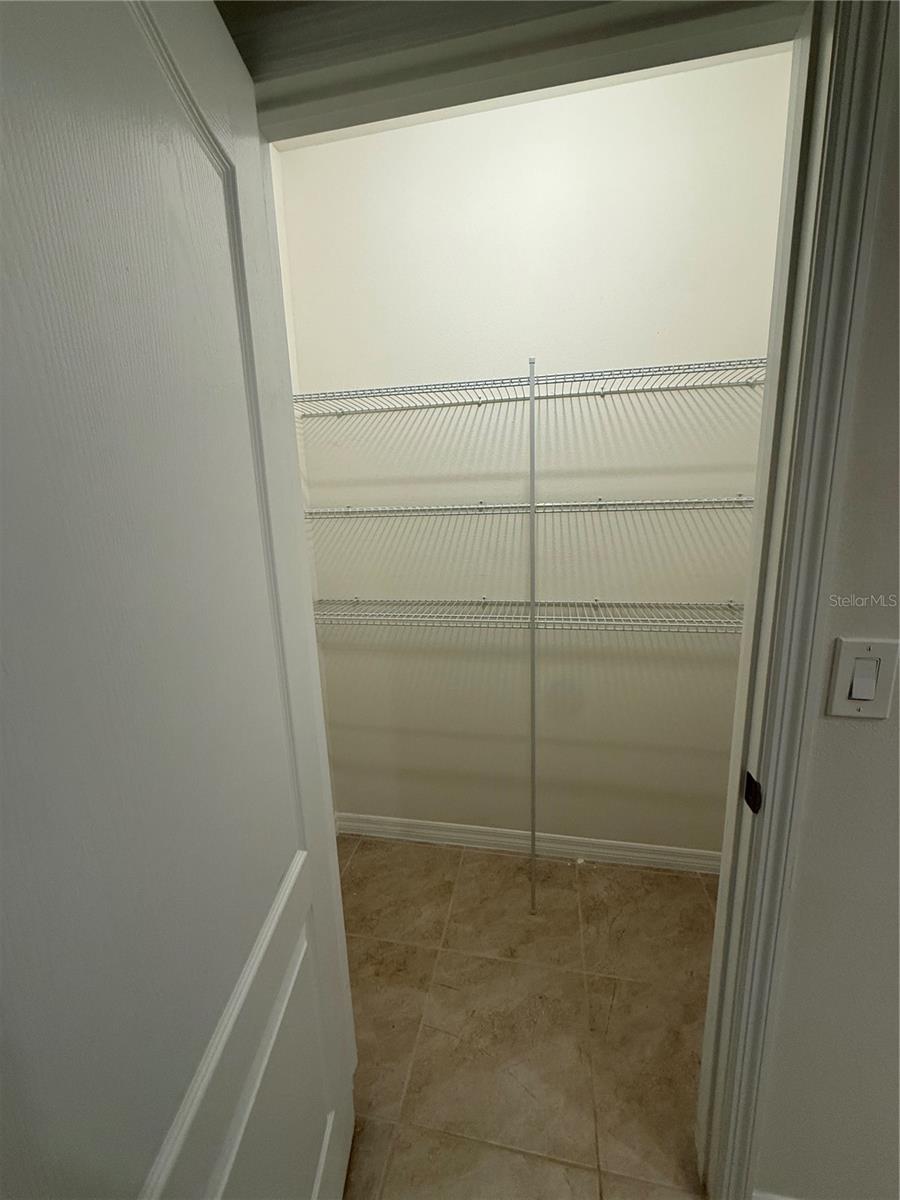 Storage closet in primary bathroom