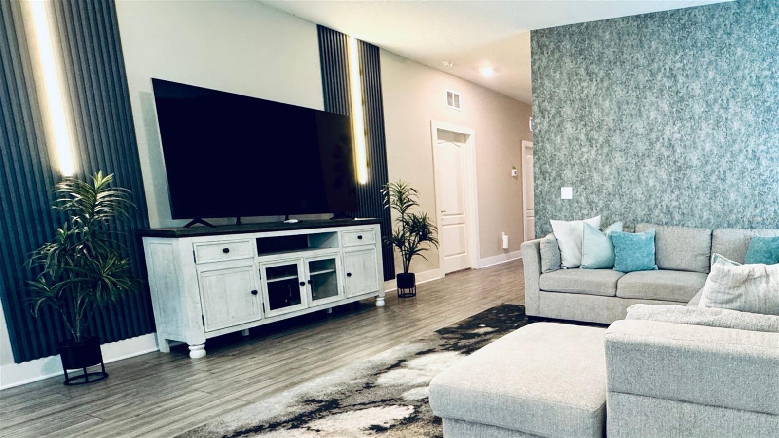 Open-concept living and dining area, fully furnished and designed for comfort and entertaining.