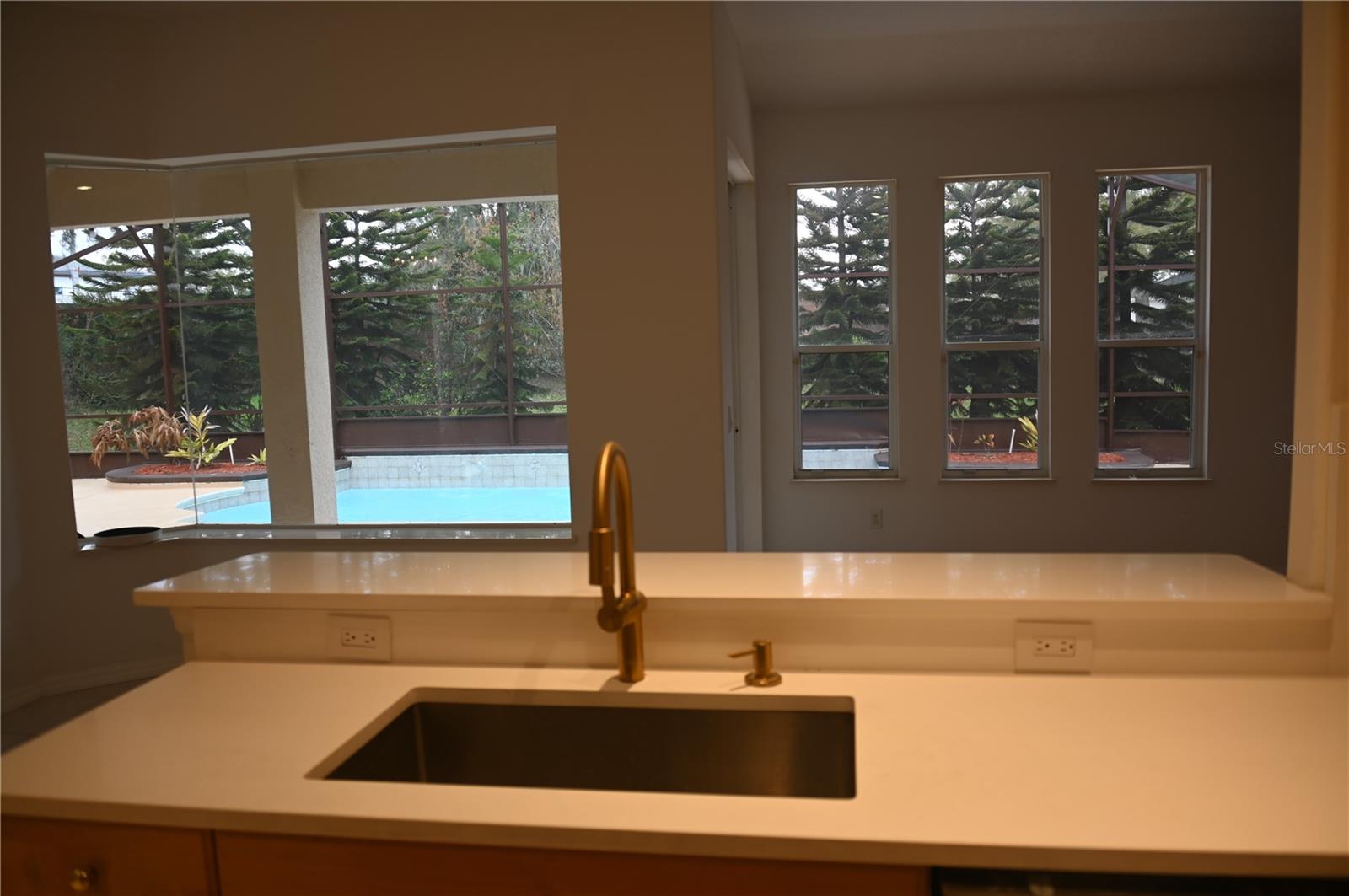 View of the pool area from the Kitchen
