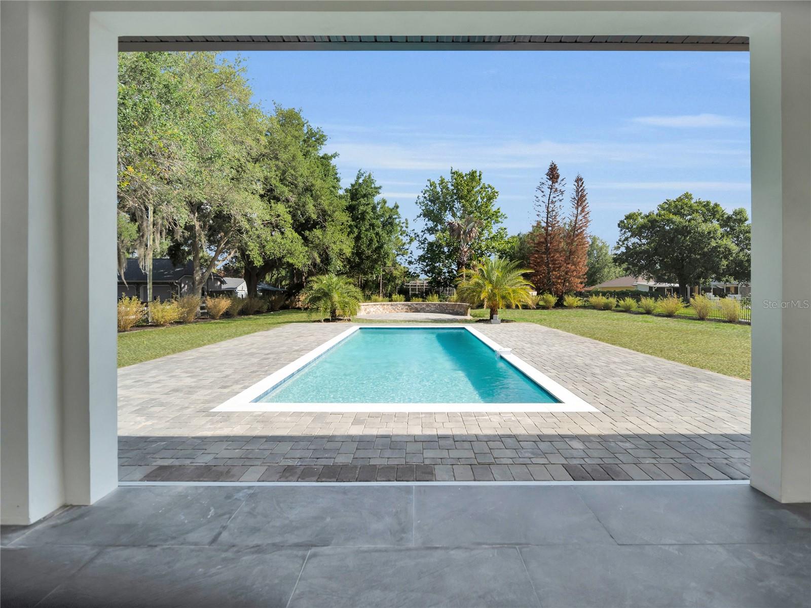 Covered lanai with pool views