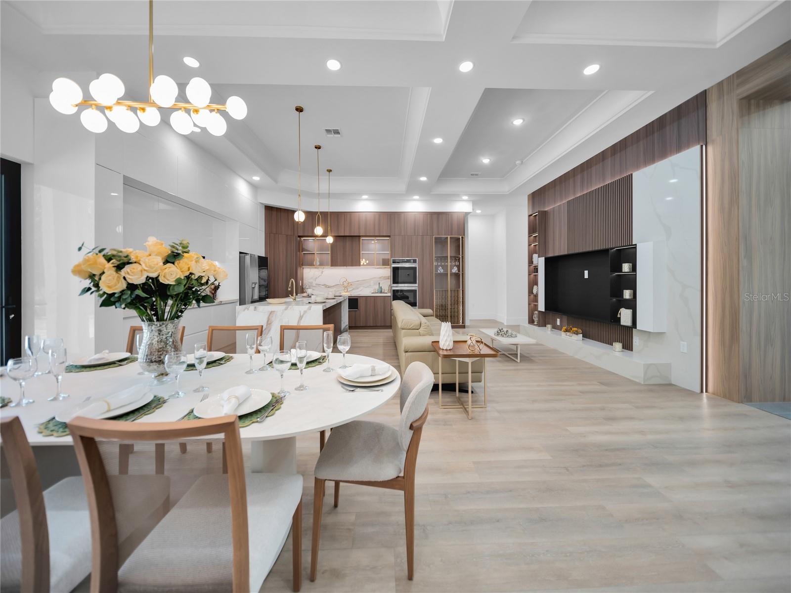 Open living, dining, and gourmet kitchen