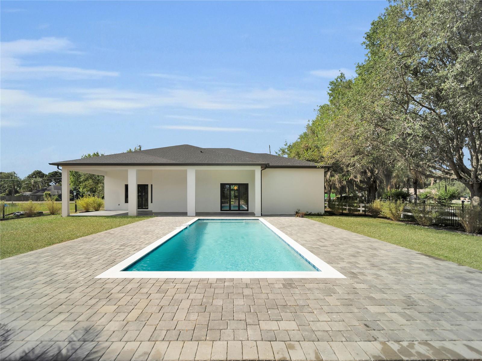 Pool with covered outdoor living access