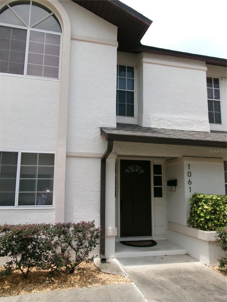 Two story stucco home with private entrance