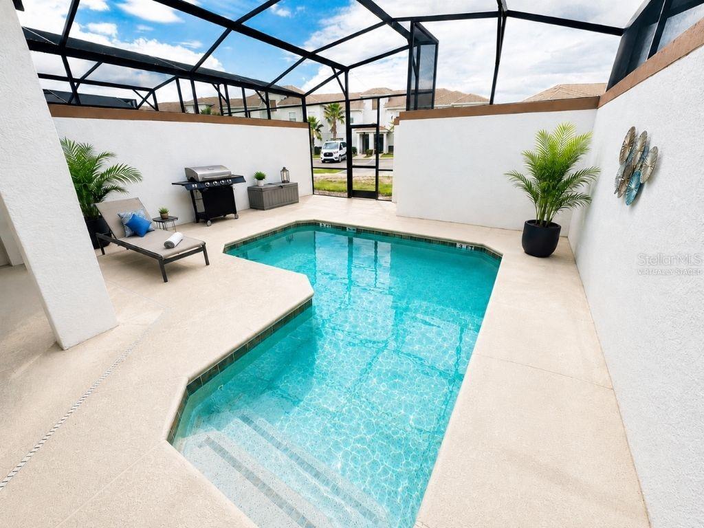 Virtually staged screened pool and patio area highlighting a private outdoor space for relaxing, entertaining, and enjoying the Florida sunshine.