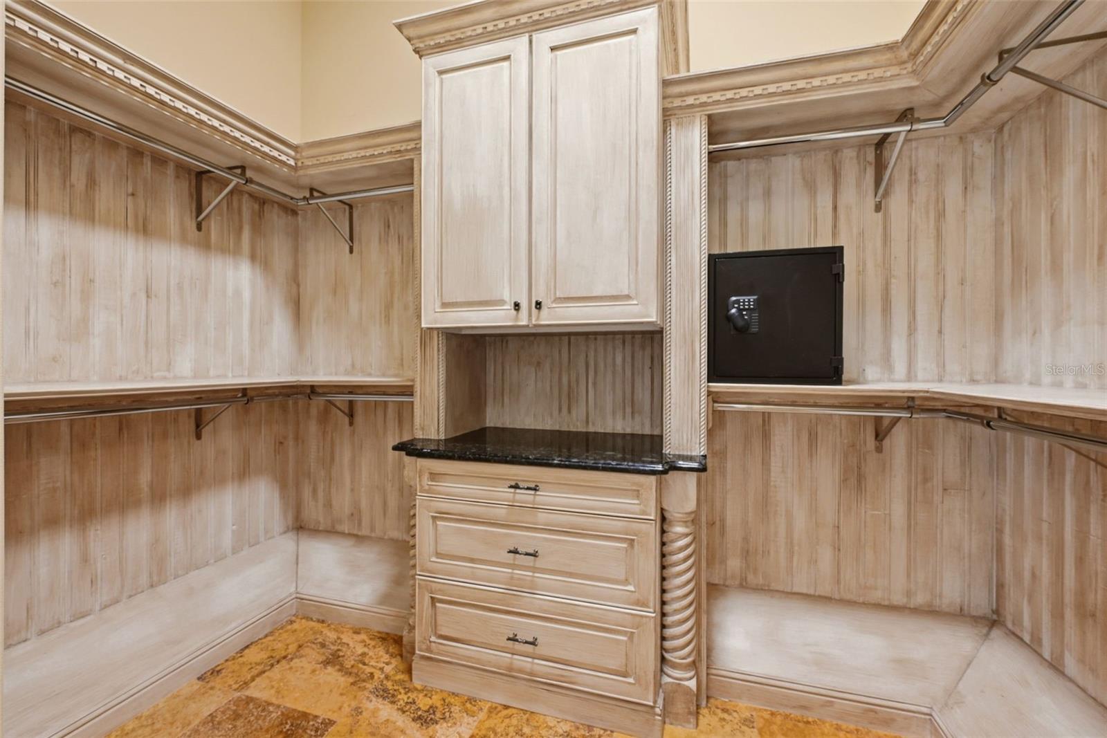 Primary Walk-In Closet with safe