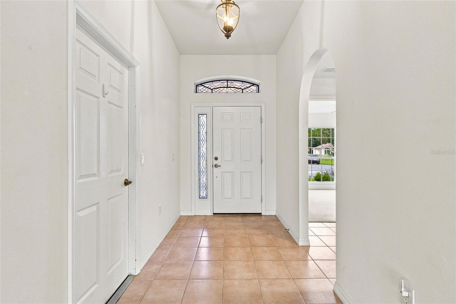 Leaded-glass sidelight and overhead window inserts custom-made by a High Vista artisan